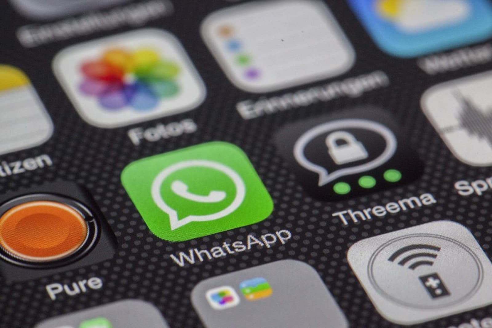 Close-up of the WhatsApp app icon on a smartphone screen